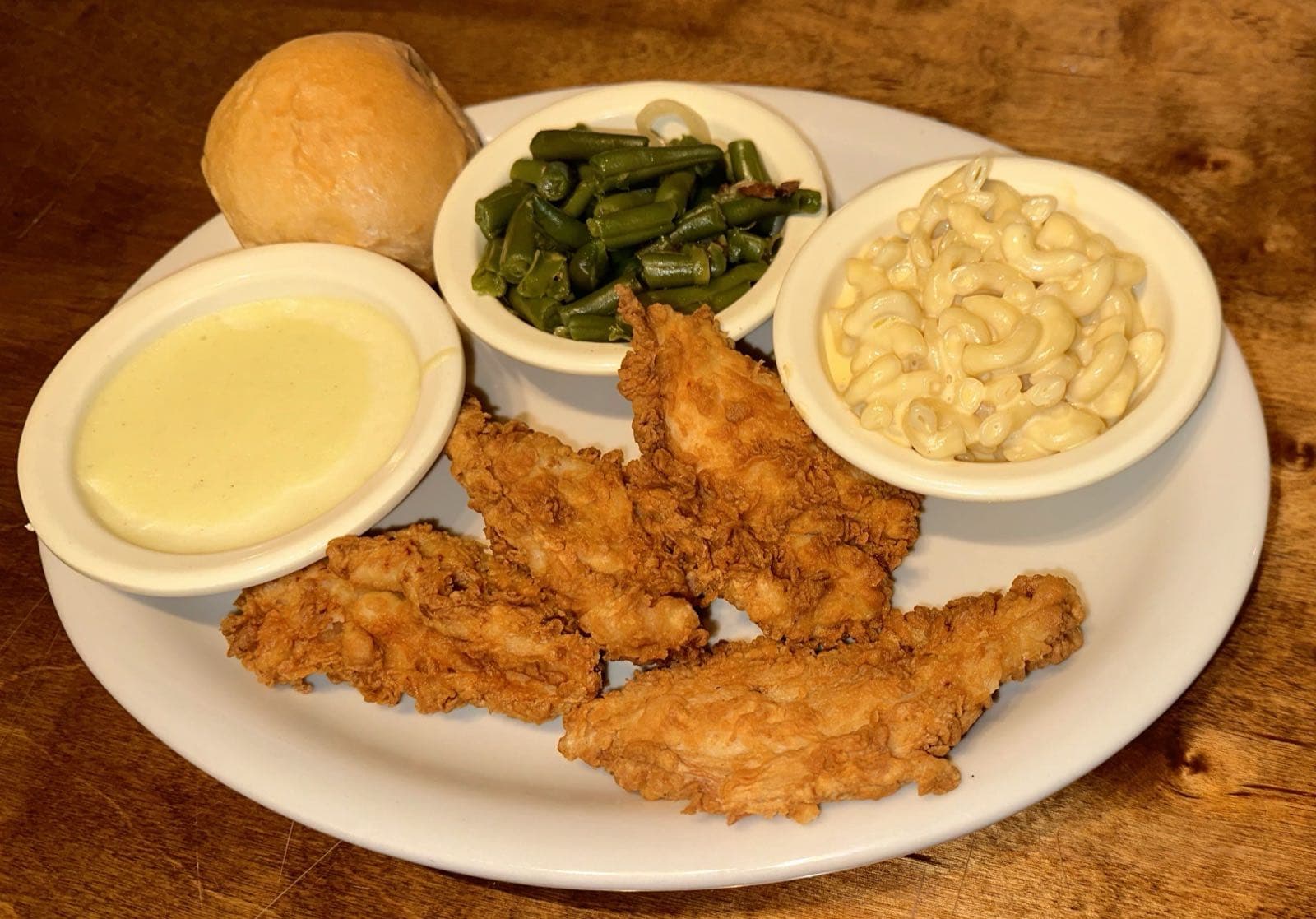 Fried chicken strips with mac and cheese and green beans